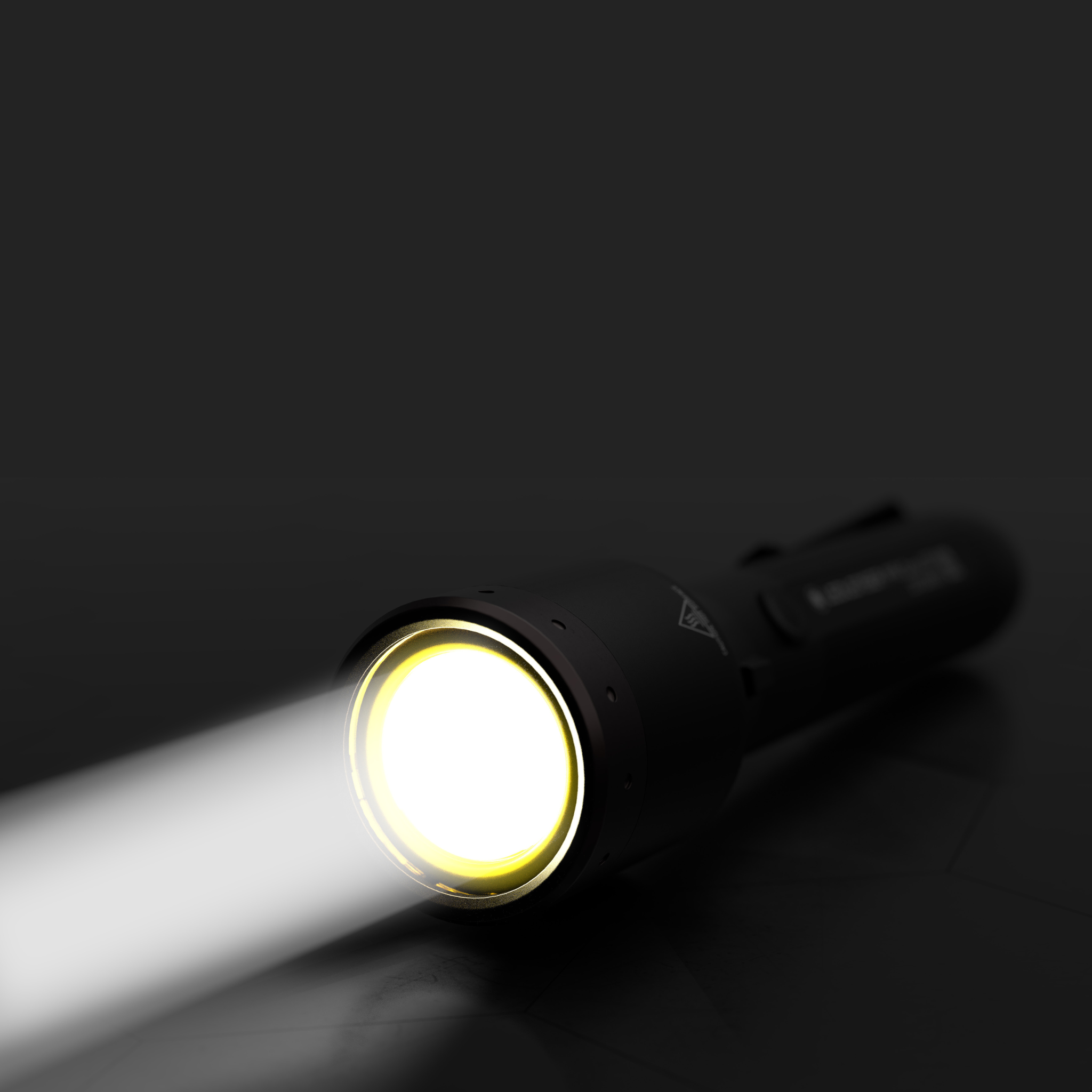 P9R LEP Torch in black angled left with a bright beam exiting the front and a yellow ring around the LED