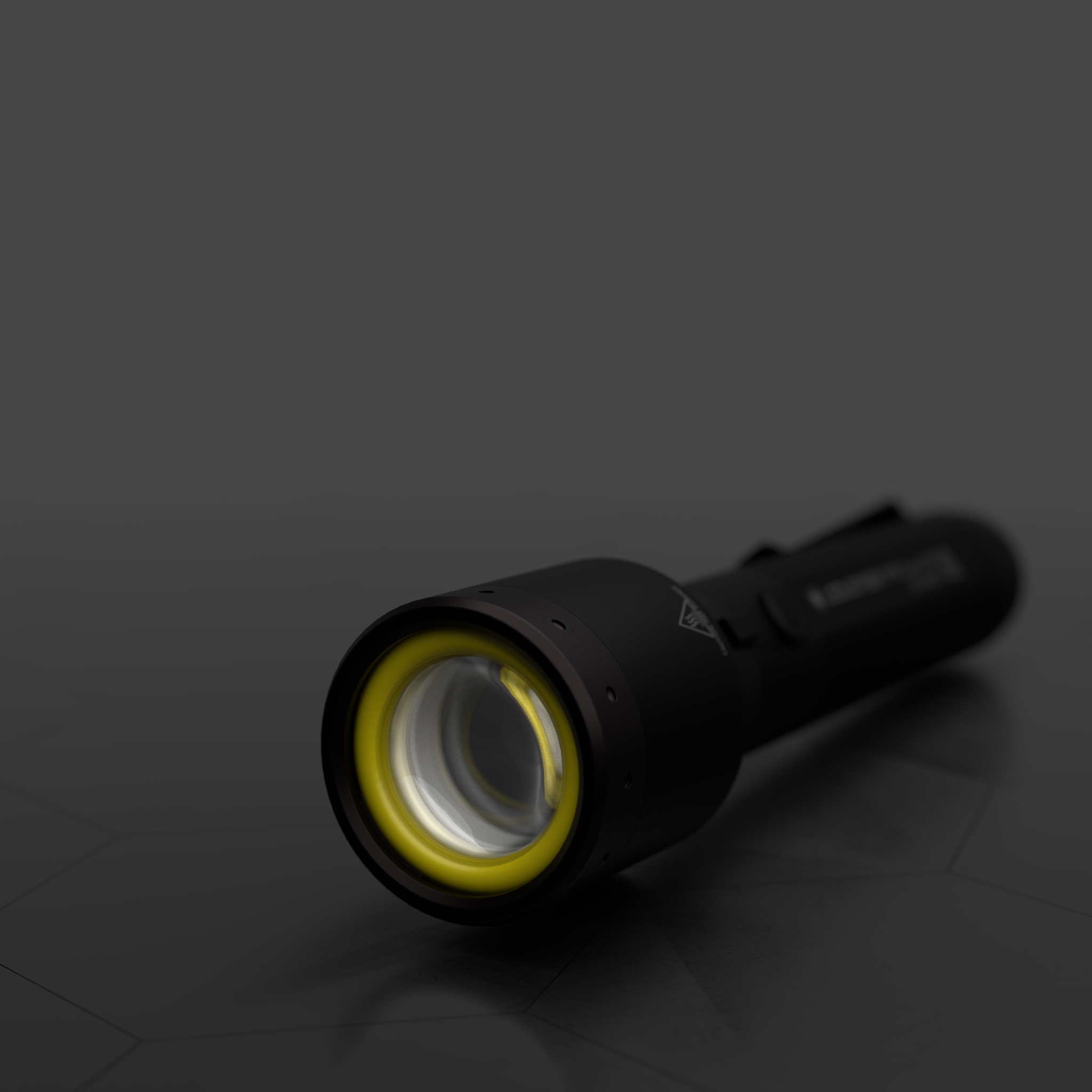 P9R LEP Torch angled view of a black handheld torch with a yellow ring around the lens at the front
