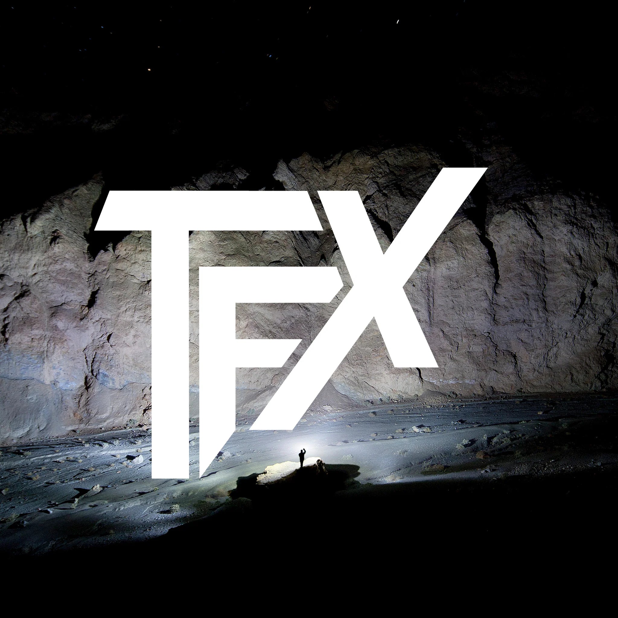 TFX Propus 3500 Torch branding image showing a large white TFX logo over a rocky cave background