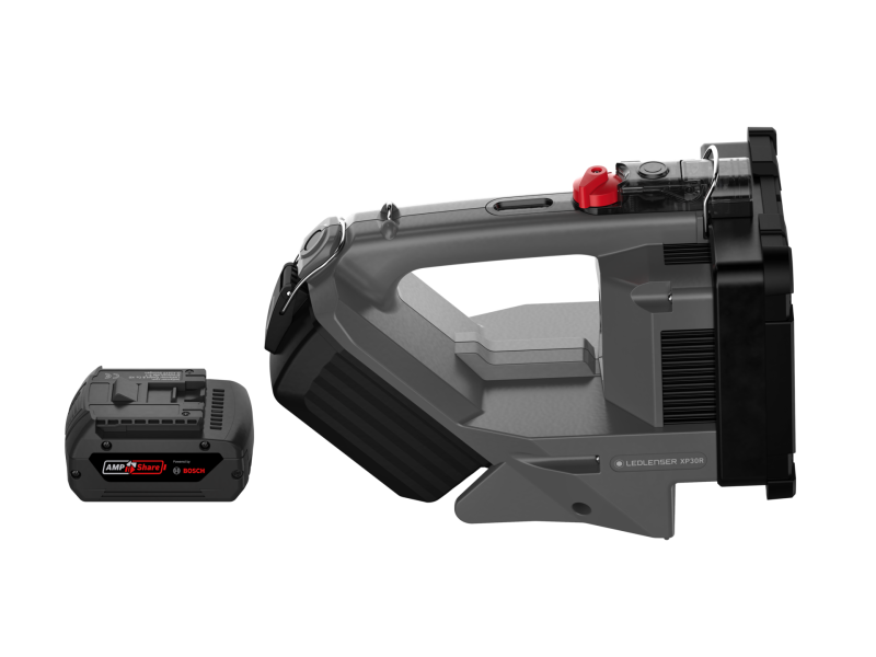 XP30R Spotlight showing a grey handheld searchlight with attached battery pack and charger for professional outdoor and industrial use