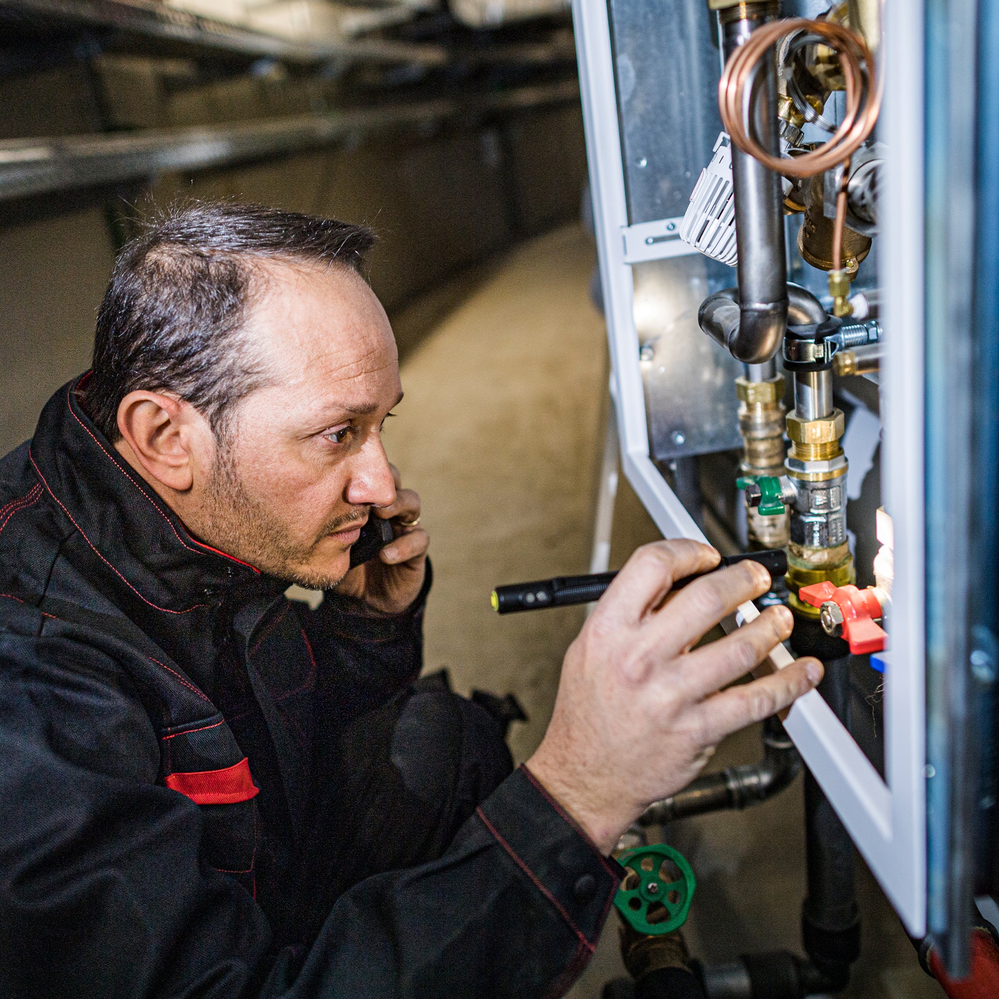 P4R Work Torch in use by a technician inspecting an electrical panel in a workshop