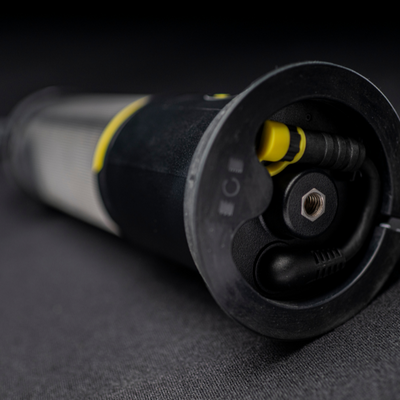 Ledlenser AL10R Work Lantern end view showing black body with yellow accents and mounting hub with connector