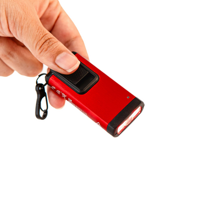 Limited Edition Red K6R Keychain Light held in hand red aluminum body with black switch and clip