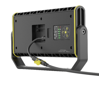 AF12C Work Floodlight seen from rear with power cable plugged in black housing with yellow accents and integrated stand