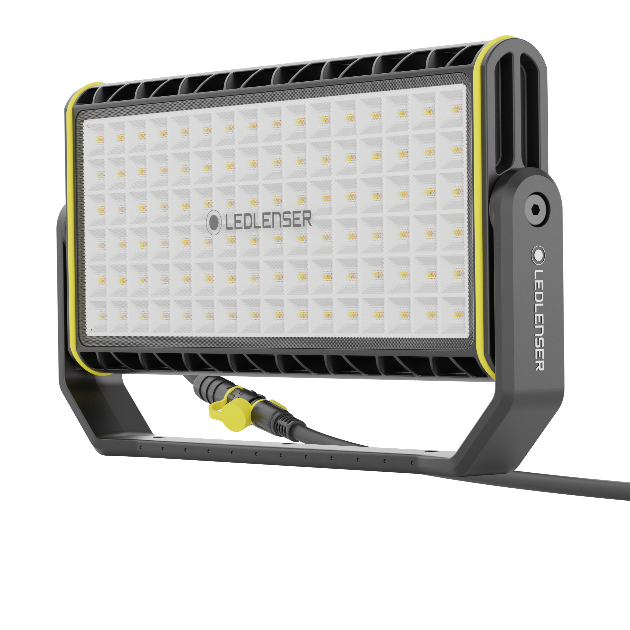 AF12C Work Floodlight featuring a rectangular LED panel with a grid of LEDs black grey housing with yellow trim mounted on a stand with power cable attached