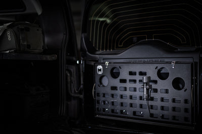 Ledlenser P5R Pro Torch mounted on a perforated storage panel inside a vehicle