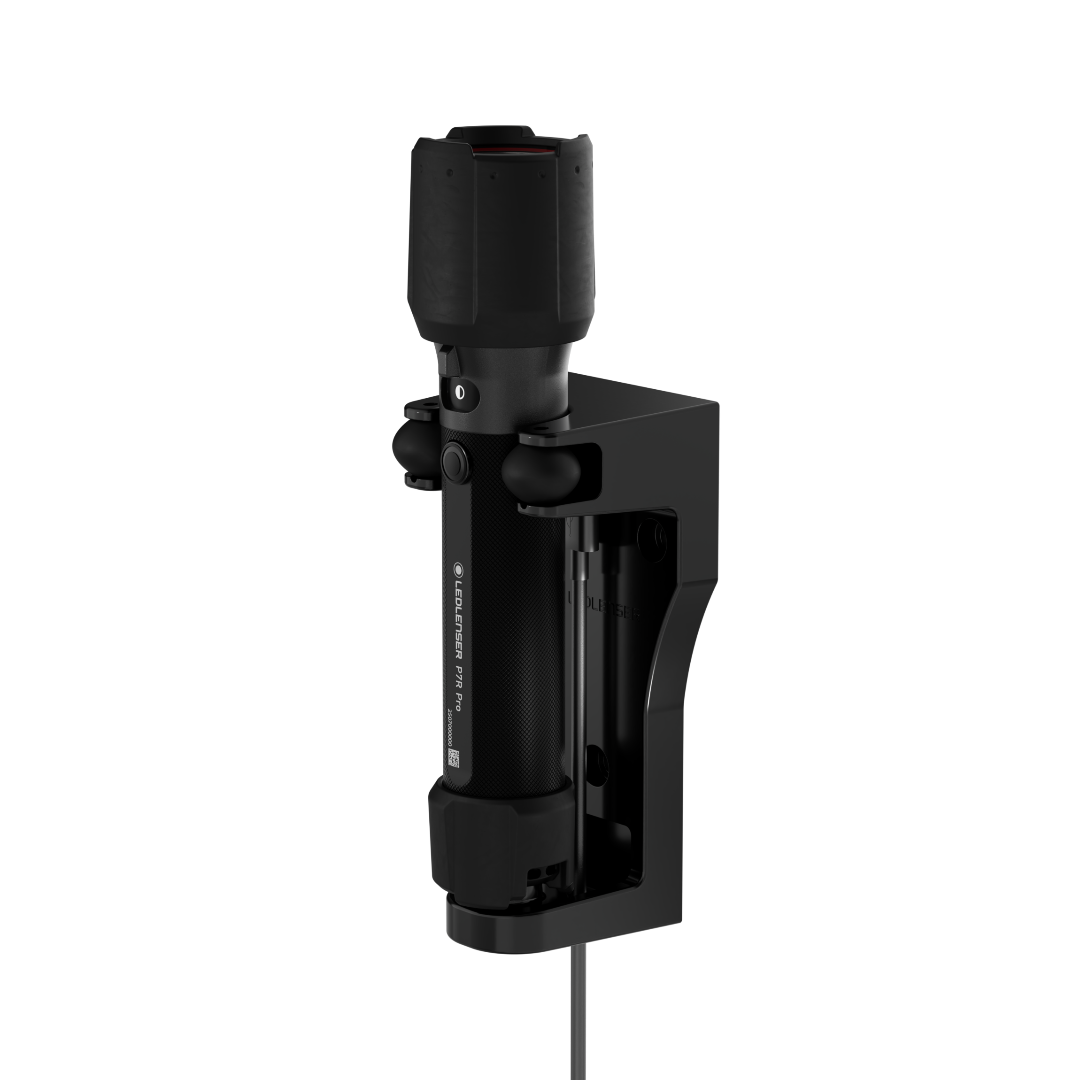 Ledlenser P7R Pro Torch mounted in a black charging dock with cable ready for professional use