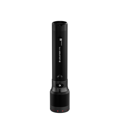 Ledlenser P7R Torch standing upright with charging base at bottom and red indicator LEDs visible