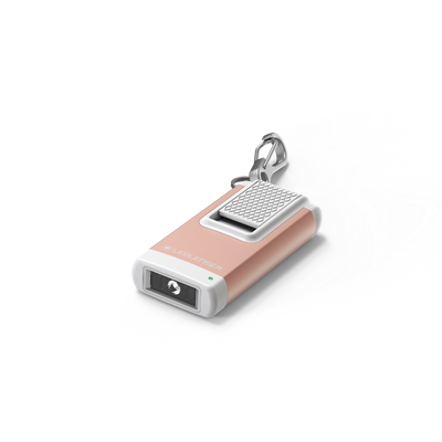 Ledlenser K4R Keychain Light compact rechargeable torch with clip and rose gold finish shown with key ring attachment and front lens