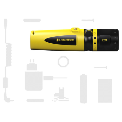 Ledlenser EX7R torch in yellow and black with charging cable and assorted accessories laid out around it