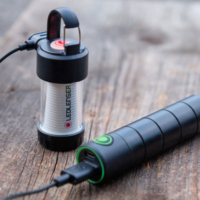 Ledlenser Flex3 Powerbank with connected USB cable and compact lantern module on a wooden surface