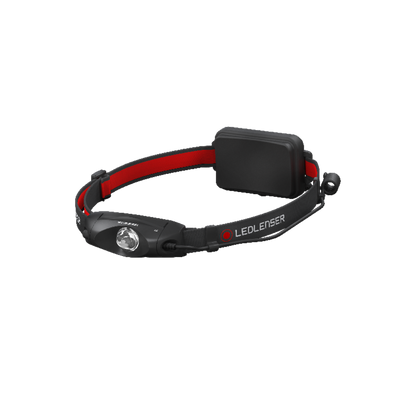 Ledlenser H4 headlamp with black body and red adjustable strap front LED lens and rear battery pack visible in side view