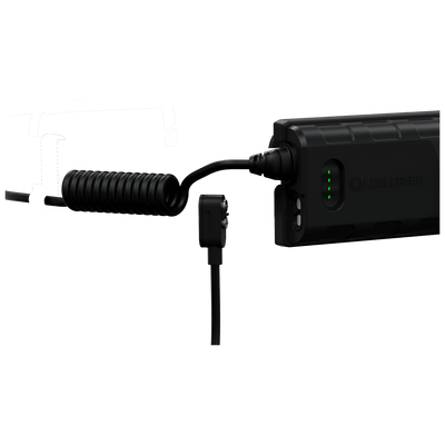 Ledlenser H5R Work Headlamp connected to its battery pack by a coiled charging cable with green indicator lights