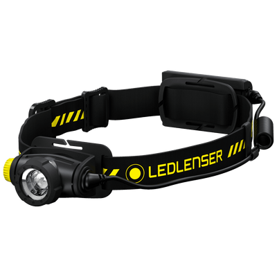 Ledlenser H5R Work Headlamp worn on head with black adjustable strap and yellow branding front LED module visible