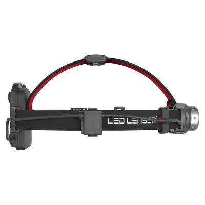 Ledlenser H6 Battery Operated Headlamp on a black headband with red interior and side battery housing visible