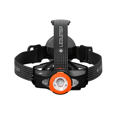 MH11 Outdoor Headlamp viewed from front with orange bezel black housing and adjustable head strap