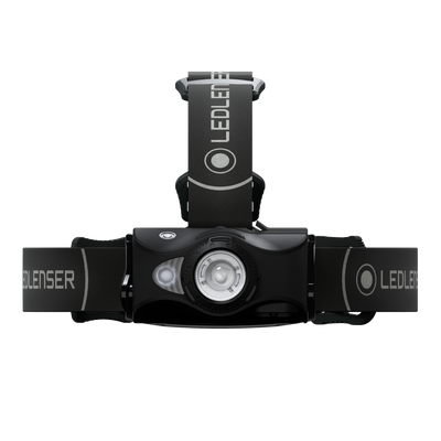 MH8 Outdoor Headlamp mounted on adjustable head strap front view showing central LED module on a black body