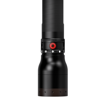 Ledlenser P17R Core Torch vertical view showing a black flashlight with a red power button and textured grip near the head