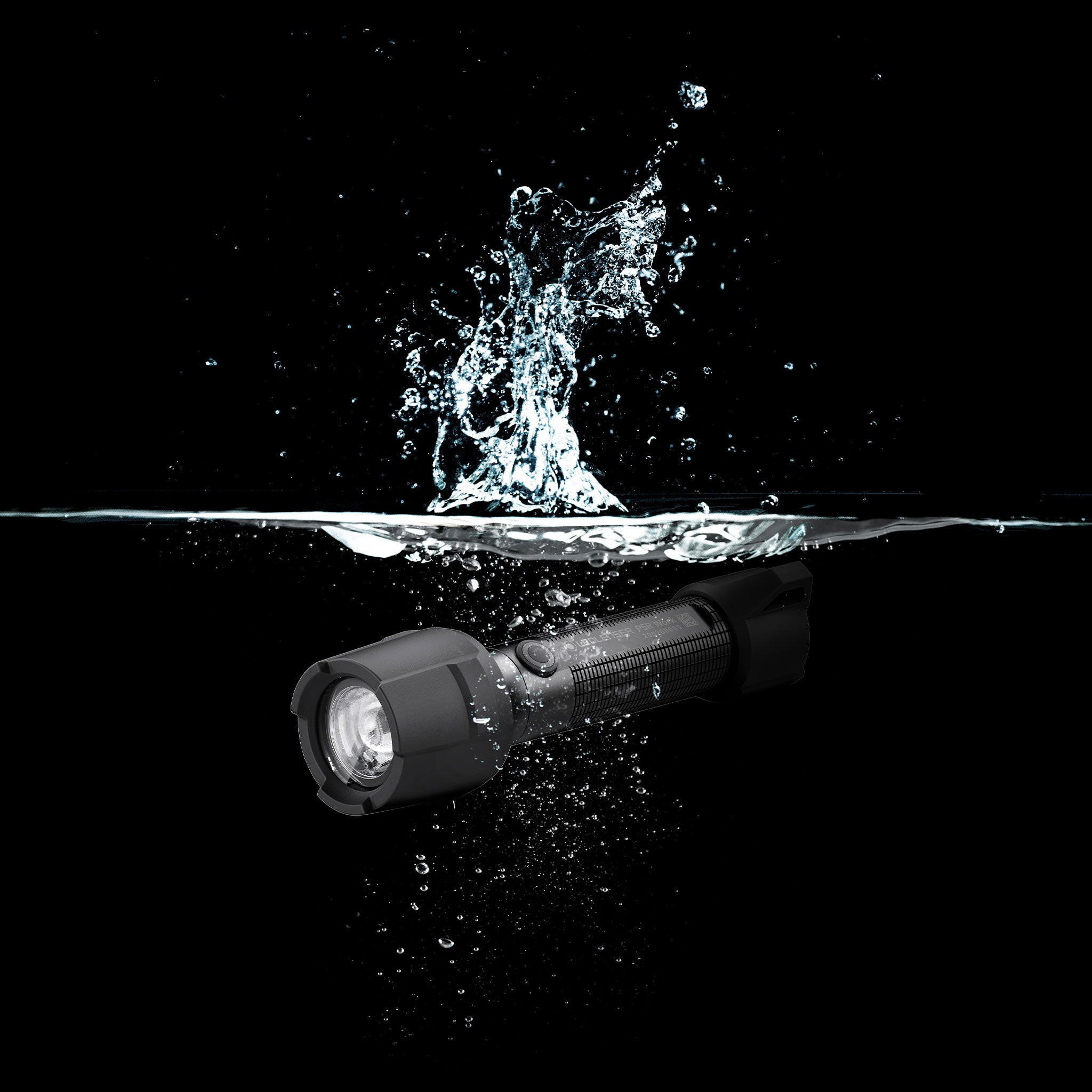 Ledlenser P5R Work Torch photographed underwater with splash showing compact rugged design