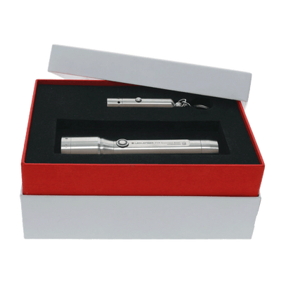 Ledlenser P7R Core Rechargeable Torch and V8 Keychain Light Stainless Steel Edition in a gift box with foam insert showing the two metal lights