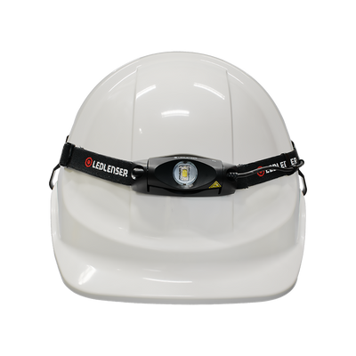 Ledlenser Universal Headlamp Headband Helmet Clip 4 Pack mounted on a white hard hat with a black adjustable strap
