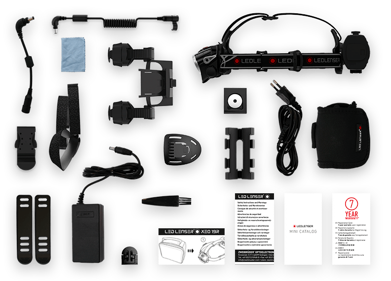 Ledlenser XEO19R White Rechargeable Headlamp with bundled accessories including charging components mounting brackets protective case and manuals