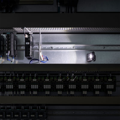 Ledlenser iF2R Spotlight mounted inside an electrical control panel with wiring and circuit modules