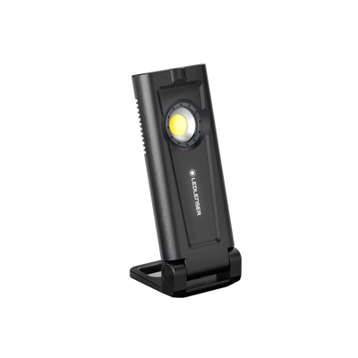 Ledlenser iF2R Spotlight compact rechargeable handheld floodlight on a black stand with integrated housing and lens