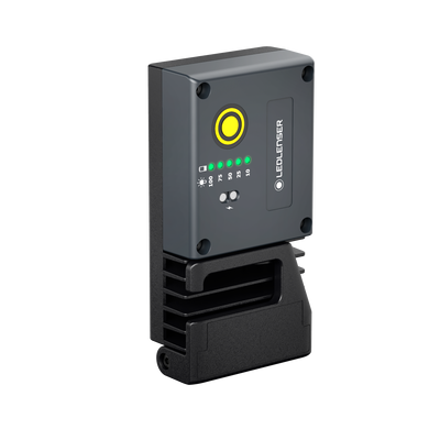 Ledlenser iF3R Spotlight charging dock with grey panel yellow power ring and green status LEDs on a black base