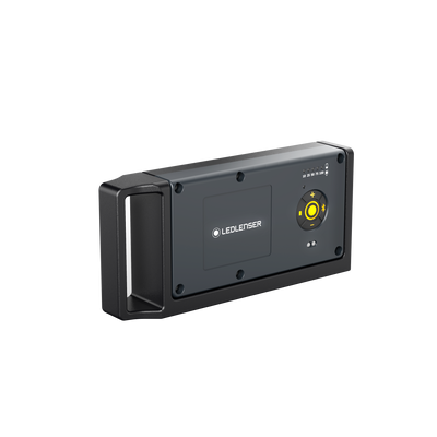 Ledlenser iF4R Music Spotlight wall mounted charging panel with yellow circular control ring and logo on dark grey surface