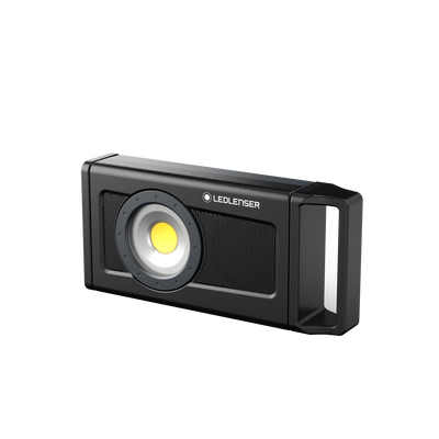 Ledlenser iF4R Music Spotlight black rectangular portable light with round LED module and integrated handle mounted on a metallic panel