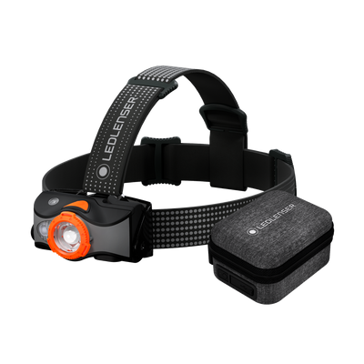 MH7 Powercase Combo headlamp with orange bezel and charging case mounted on adjustable head strap